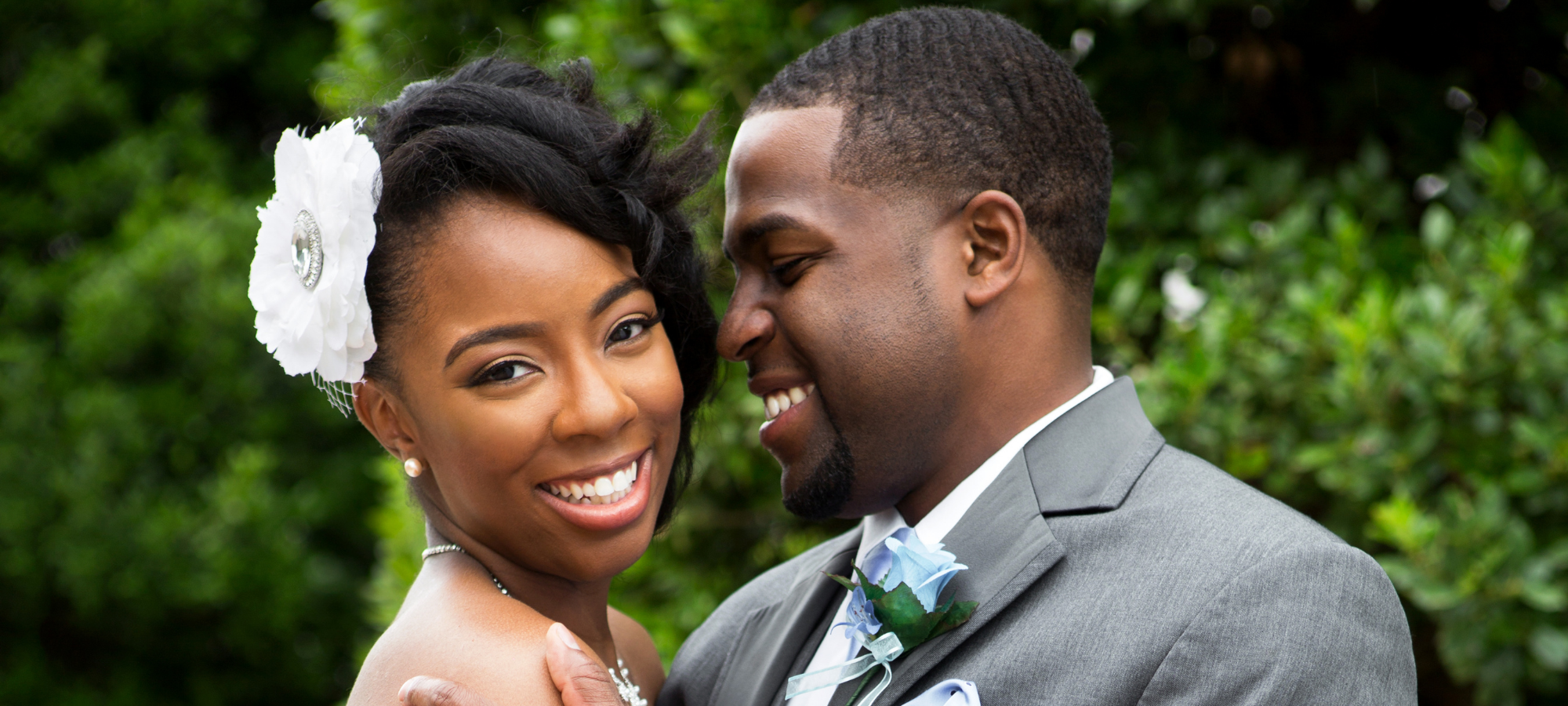 newly wedded couple smiling 